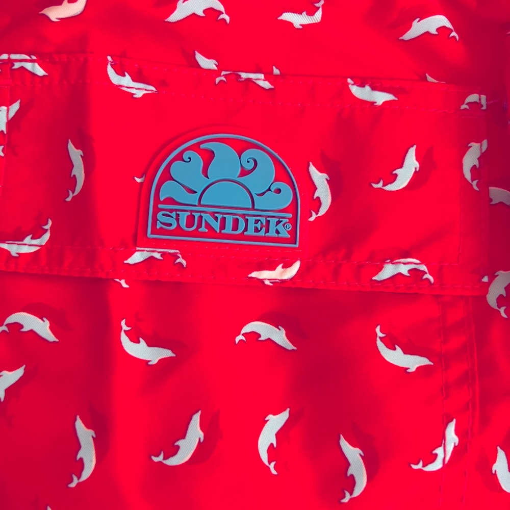 SUNDER Mens bathing suit. Brand new WOT. Brilliant red with mini blue dolphins